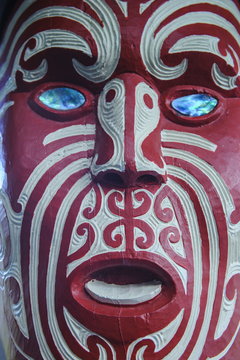 Traditional wood carved mask in the Te Puia Maori Cultural Center, Rotorura, North Island, New Zealand