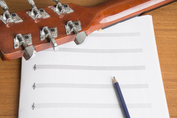 guitar notebook and pencil