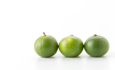 green lemon isolated on white background