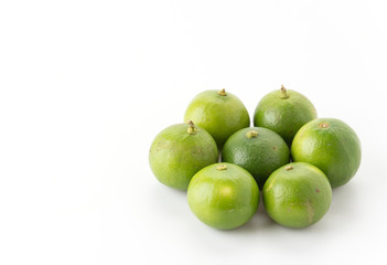 green lemon isolated on white background