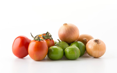 tomatoes, onions, green lemons on white