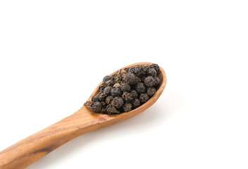 Black pepper with wood spoon