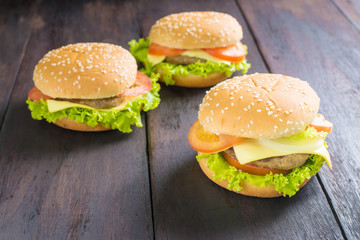 Delicious homemade hamburger on wooden desk.