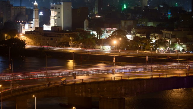 Time lapse of traffic in Cairo center at night. The 15th May Bridge / 26th July Corridor in the foreground, the Corniche in the background