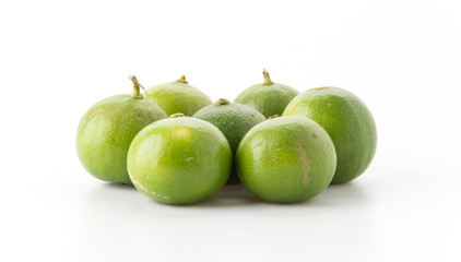 green lemon isolated on white background