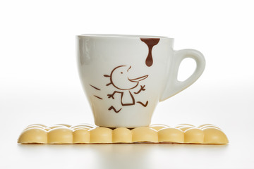 White chocolate bar. Coffee cup. White background