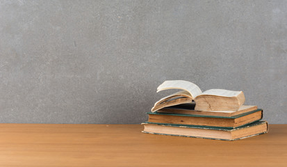 stack of old books on wood table