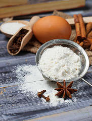 Obraz na płótnie Canvas Ingredients for baking - egg, flour, sugar, anise, cinnamon