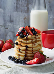 Breakfast with pancakes, coffee and milk