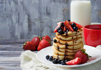 Breakfast with pancakes, coffee and milk