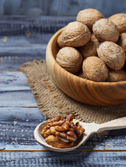 Walnuts in old wooden bowl