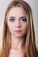Obraz na płótnie Canvas Closeup portrait of blonde long hair girl