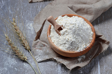 Wheat flour in wooden bowl