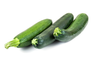 Fresh courgettes on white background