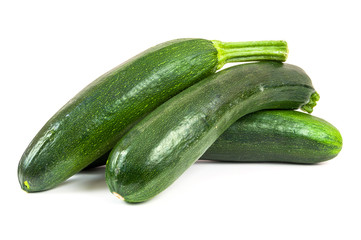 Fresh courgettes on white background