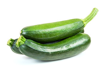 Fresh courgettes on white background