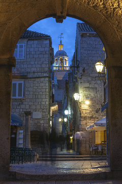 St. Marko Bell Tower and Land Gate illuminated at dusk, Korcula Town, Korcula, Dalmatia, Croatia