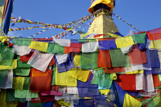 Prayer flags in front of Boudha (Bodhnath) (Boudhanath) Tibetan stupa in Kathmandu, Nepal