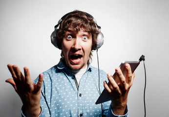 Surprised hipster . Closeup portrait shouts man and listening