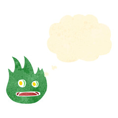 retro cartoon green flame character with thought bubble