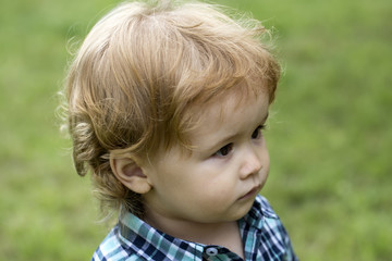 Boy kid on green grass