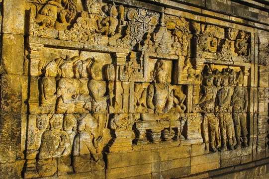 Buddha reliefs in the temple complex of Borobodur, Java, Indonesia