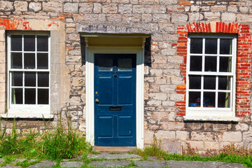 Fassade eines alten Steinhauses in Vicars Close, Wells, England