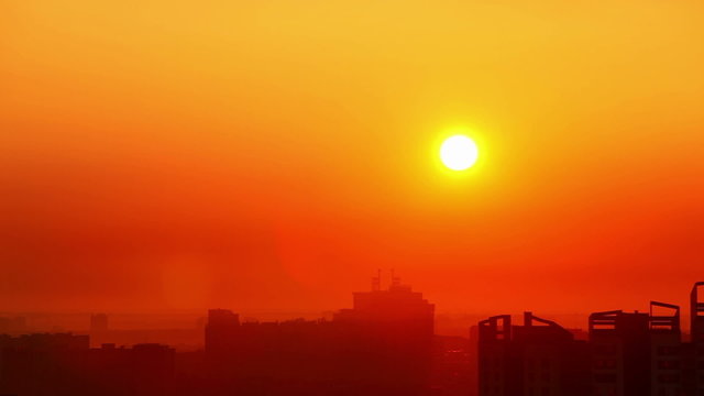 Red sunrice over city.
