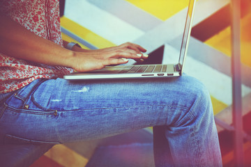 Hands using laptop and typing