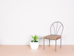 plastic plant and mini chair, minimalism style