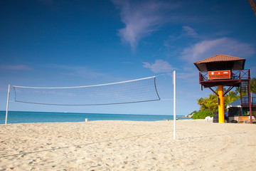Beach volleyball under clear skies