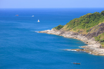 Cape is a mountain of rock that extends into the sea view  in Phuket, Thailand