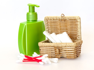Subjects for care of face skin: wadded disks, Q-tips, lotion bottle