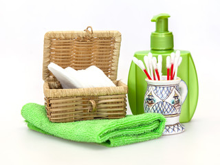 Subjects for care of face skin: wadded disks, Q-tips, lotion bottle