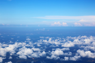 Fototapeta na wymiar Skyline View above the Clouds from air plane