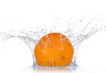 Fresh oranges with water splashes.