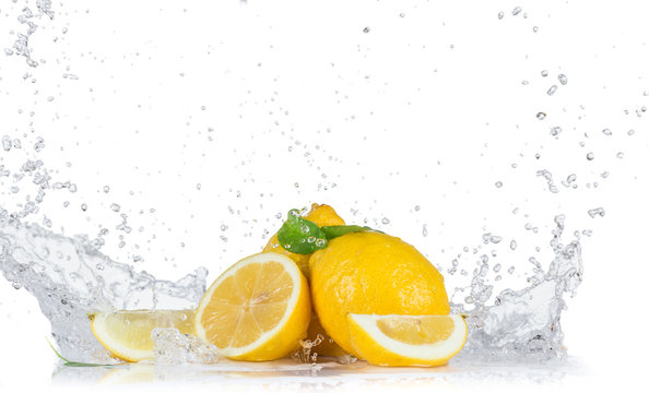 Fresh lemons with water splashes