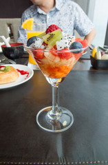 cocktail of fresh fruits salad in restaurant