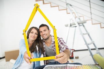 couple in new home choosing wall paint colors
