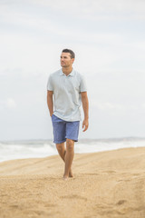 man walking on the beach