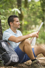 Young backpacker with a map