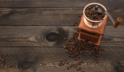 coffee mill on wooden background