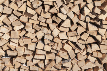 Stack of wood. The stock of firewood. Birch firewood.