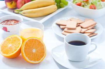 Obraz na płótnie Canvas Continental breakfast with fruit , coffee , cheese , vegetables
