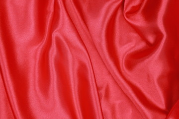 Fototapeta na wymiar Red Silk cloth of wavy abstract background