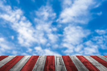 Empty wooden deck table with dusk sky background