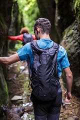 Teenager with backpack on a canyon