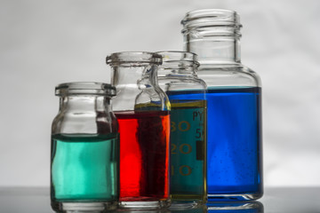Set of laboratory bottles with color liquid