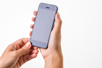 Female hand holding a smart phone, isolated on white