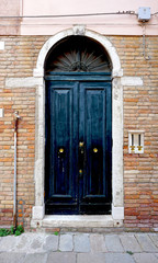 door on old brick wall building